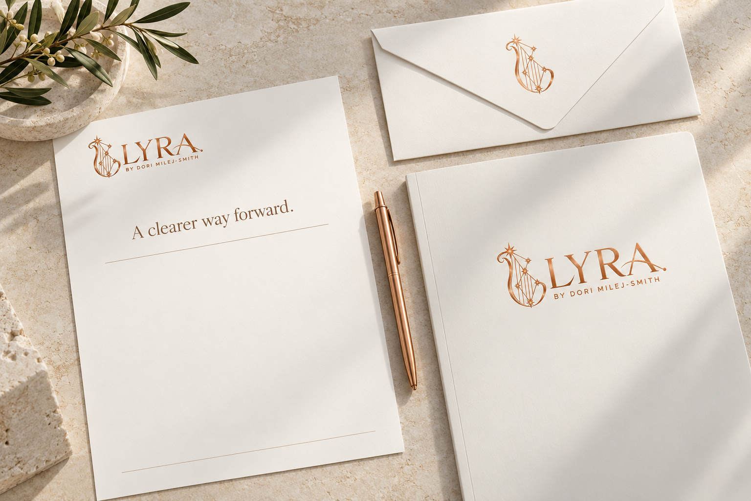 Coordinated ivory LYRA letterhead, envelope and presentation folder with a copper pen.